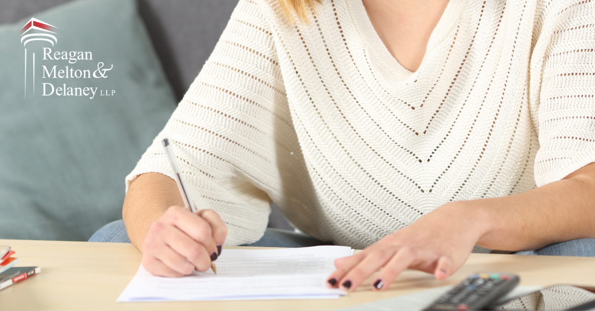 woman writing on a piece of paper