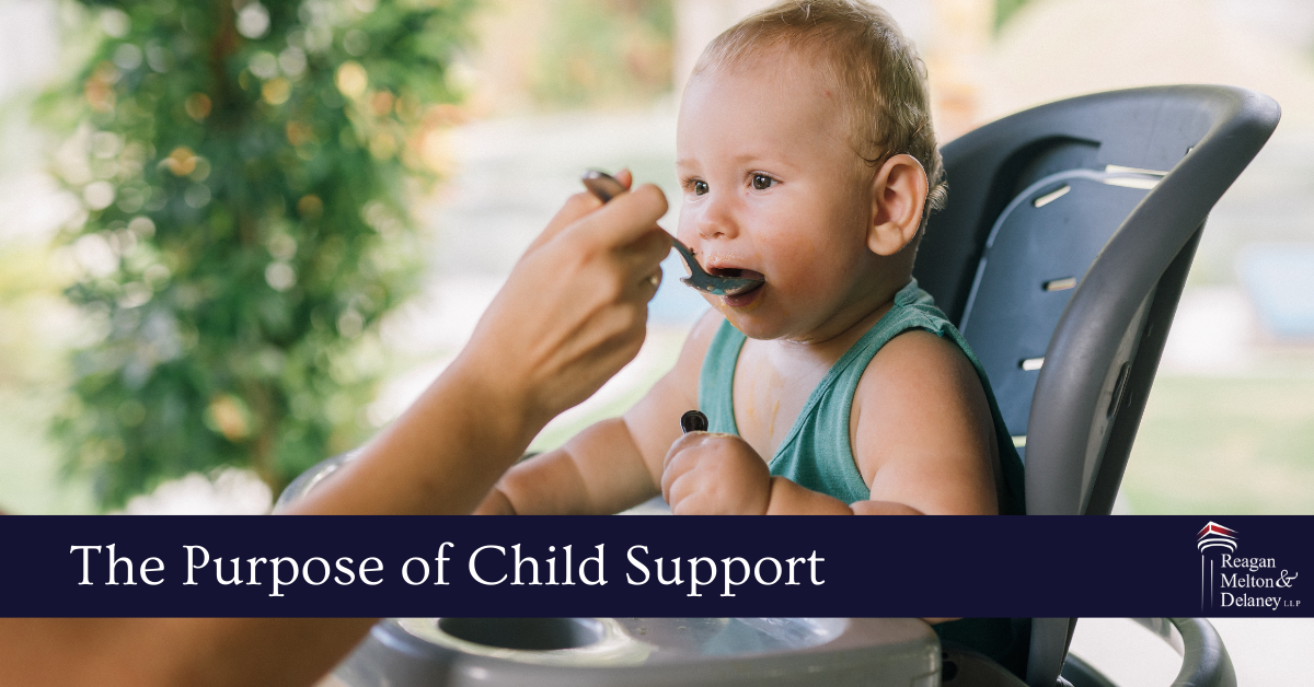 baby in highchair being fed